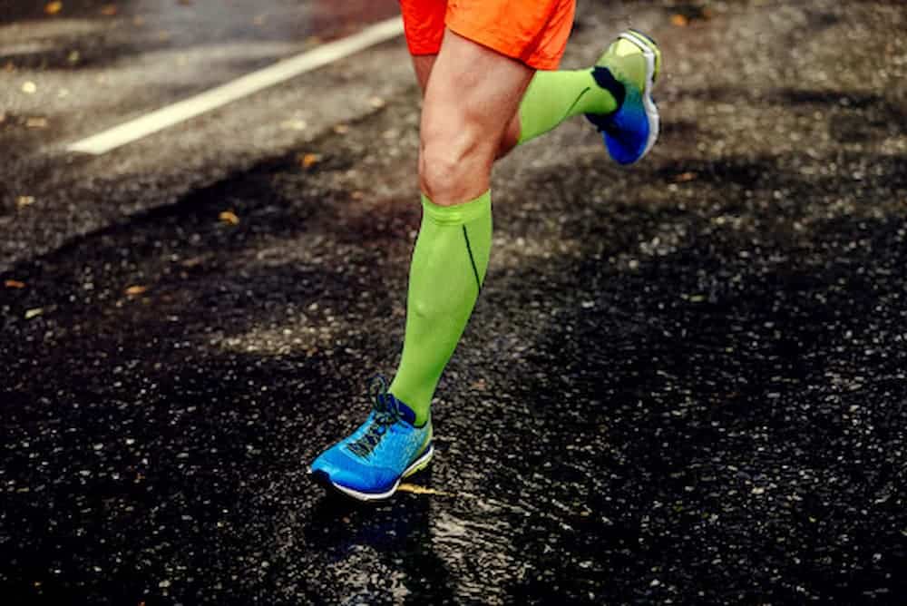 Man-wearing-compression-socks-as-he-runs