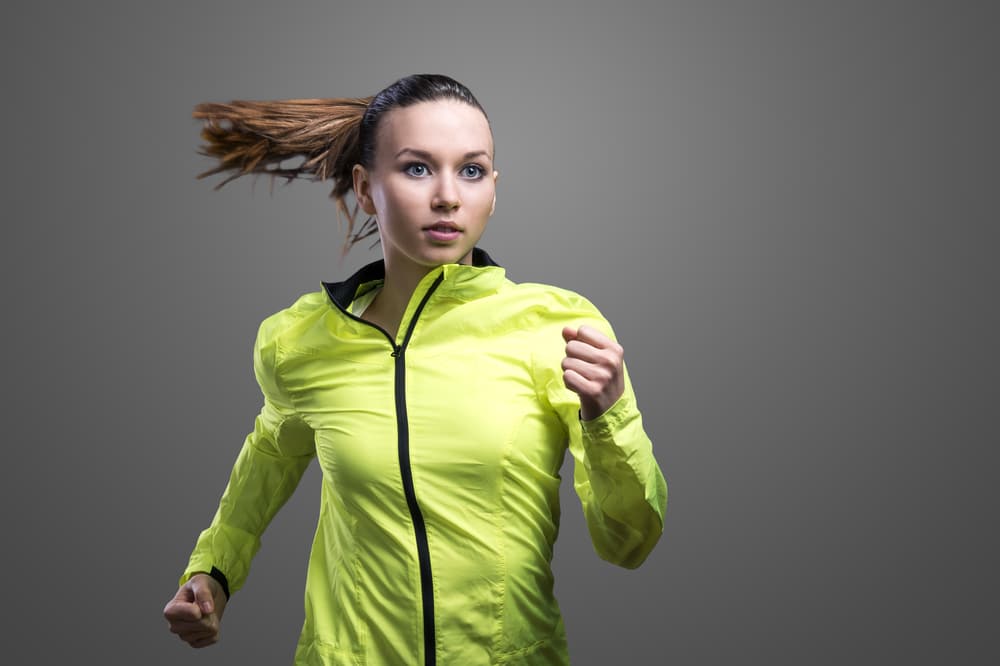 Young-woman-wearing-reflective-waterproof-running-jacket